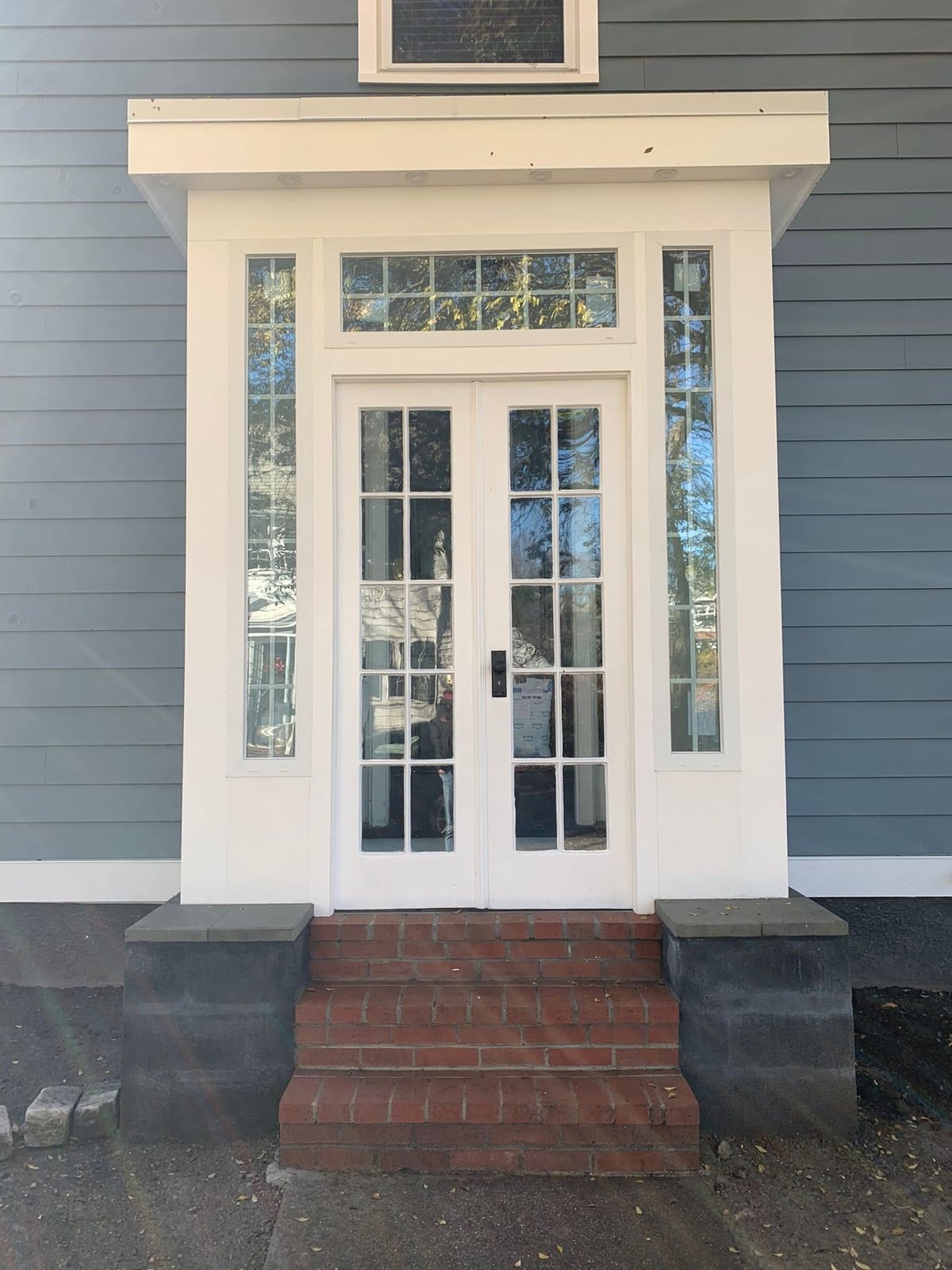 French-door entry with sidelights and transom window