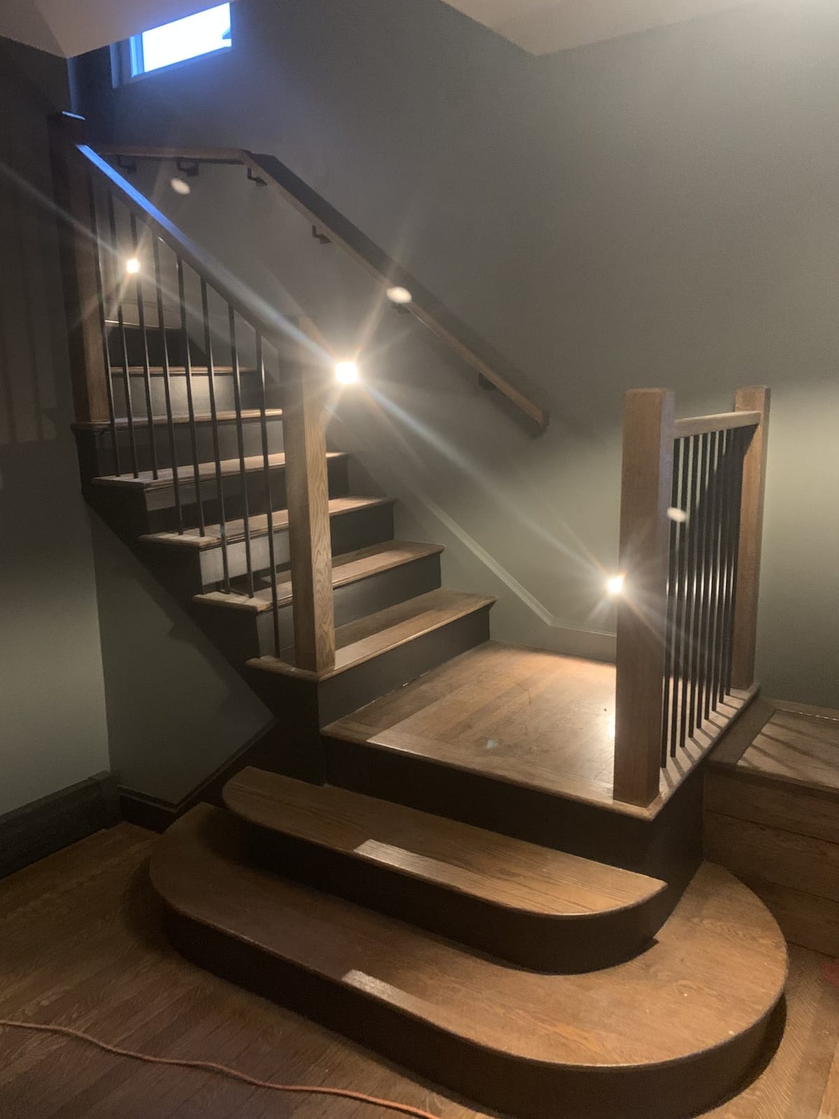 Custom staircase with wood treads and metal balusters